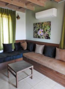 a living room with two couches and a table at Ajloun Forest Reserve in Jerash