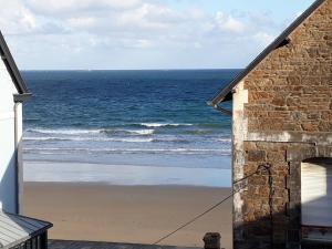 a view of the ocean from the balcony of a house at Les Vigies by Cocoonr in Saint Malo