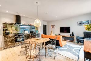 a living room with a couch and a table at Notting Hill Playhouse in London