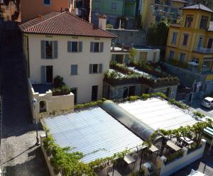 an aerial view of a building with solar panels at Hotel Olivedo in Varenna