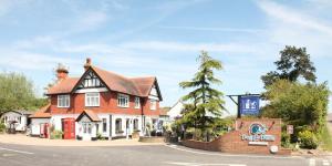 a building on the corner of a street at Countryside Holiday Park by the River nr Canterbury (Pet-Friendly) in Canterbury