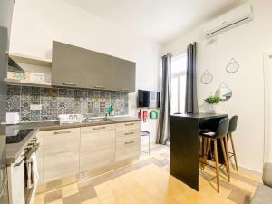a kitchen with a sink and a counter top at Unique two bedrooms apartment 6 in Il-Gżira