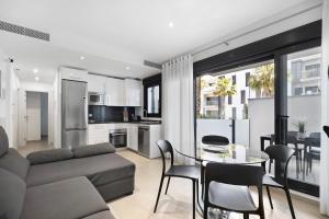 a living room with a couch and a table at Apartamento Punta Candor in Rota