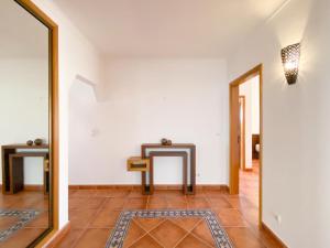 a hallway with a mirror and a tile floor at Spacious villa in Portimão ideal for families #1938 in Portimão