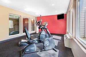 a gym with a exercise bike in a room at Ramada by Wyndham Hendersonville in Hendersonville