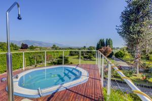 a hot tub on the deck of a house at Villa Luce-Casa vacanza con vista panoramica mare. in Velletri