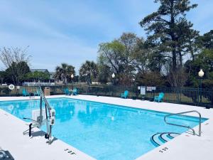 a large swimming pool with snow on it at Blue Water Inn & Suites BW Signature Collection in North Topsail Beach