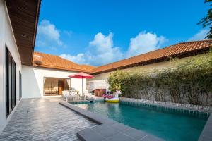 Bazén v ubytování Majestic Residence Pattaya มาเจสติก พูลวิลล่าส์ 46 nebo v jeho okolí