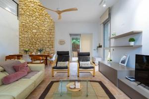 Posezení v ubytování Acogedora Villa en Alicante con piscina & barbacoa