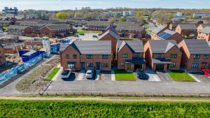 an aerial view of a house with a parking lot at Stunning 2-Bed House in Manchester with canal view in Manchester