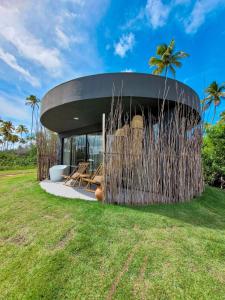 a modern house with a round roof at Taboo Milagres in São Miguel dos Milagres