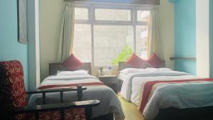 Postel nebo postele na pokoji v ubytování Hotel Discovery Inn