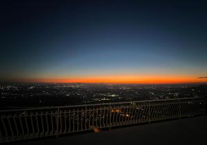 a view of the sunset from the top of a building at Super panoramic new apartment in Casertavecchia in Caserta