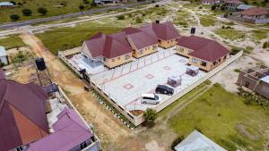 an overhead view of a large house with a garage at Dodoma Shine Lodge in Dodoma