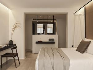 Ένα ή περισσότερα κρεβάτια σε δωμάτιο στο Ezio Bo Luxury Living