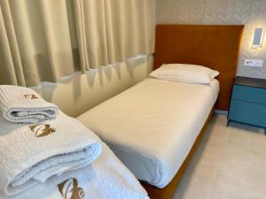 Voodi või voodid majutusasutuse Alloggi Be Deluxe toas