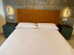 Voodi või voodid majutusasutuse Alloggi Be Deluxe toas