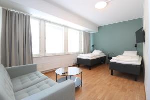 Postel nebo postele na pokoji v ubytování Forenom Aparthotel Helsinki Herttoniemi