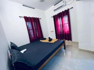 A bed or beds in a room at SAND BEACH HOUSE VARKALA