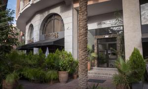 a store front with plants in front of it at Résidence Las Palmeras in Marrakesh