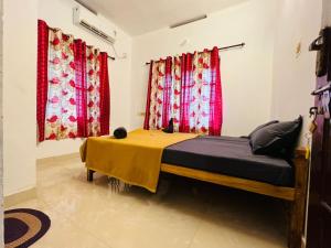 A bed or beds in a room at SAND BEACH HOUSE VARKALA