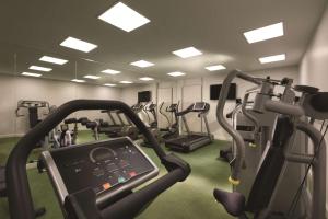 a gym with treadmills and elliptical machines at Adina Apartment Hotel Berlin Hackescher Markt in Berlin