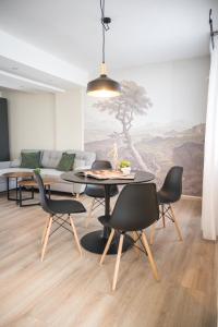 a dining room with a table and chairs at BEST APARTMENTS in Bitola