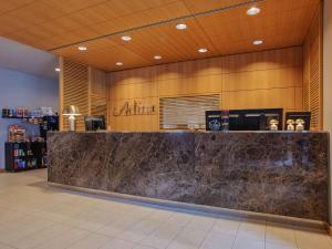 a lobby with a marble counter in a store at Adina Apartment Hotel Berlin Mitte in Berlin