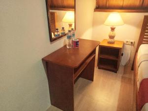 Postel nebo postele na pokoji v ubytování Uki village bungalows