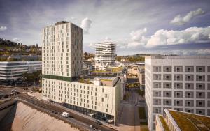 an aerial view of a city with tall buildings at Adina Apartment Hotel Stuttgart in Stuttgart +13 photos