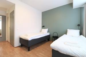 Postel nebo postele na pokoji v ubytování Forenom Aparthotel Helsinki Herttoniemi