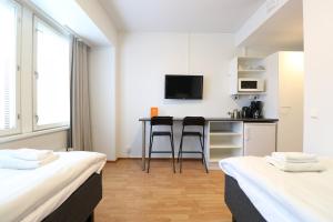 Kuchyň nebo kuchyňský kout v ubytování Forenom Aparthotel Helsinki Herttoniemi
