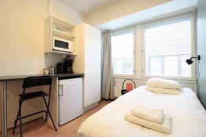 Postel nebo postele na pokoji v ubytování Forenom Aparthotel Helsinki Herttoniemi