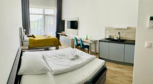 TV a/nebo společenská místnost v ubytování Apartmány Tatry