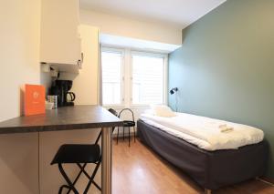 Postel nebo postele na pokoji v ubytování Forenom Aparthotel Helsinki Herttoniemi