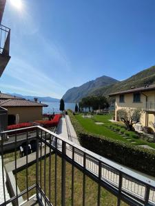 a view of the water from the balcony of a house at Alex's lake house in Riva di Solto