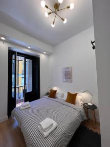 En eller flere senge i et værelse på Urban rooms Fuencarral