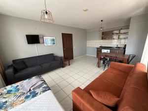 a living room with a couch and a table at Maren City Apart Hotel in Alanya