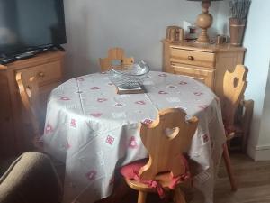 a dining room table with a table cloth on it at Appartement Valloire, 2 pièces, 4 personnes - FR-1-263-219 in Valloire