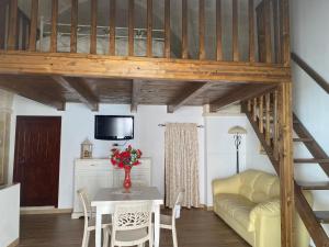 a living room with a couch and a table at Casa Muscettola in Leporano
