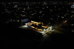 a night view of a building with lights at Dianamar house, Te mereces disfrutarlo in Ríohacha