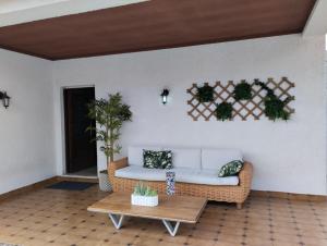 a living room with a couch and a table at Hostel Summer House in Vila Nova de Gaia