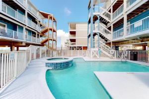 a swimming pool in the middle of a building at Sunchase #208 in Gulf Shores