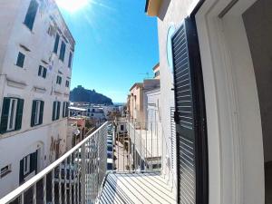 a balcony with a view of a city at B&B A Due Passi in Ischia