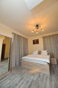 Ένα ή περισσότερα κρεβάτια σε δωμάτιο στο Altunyan Hotel