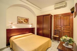 Postel nebo postele na pokoji v ubytování Hotel Primavera