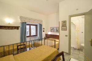 Postel nebo postele na pokoji v ubytování Hotel Primavera