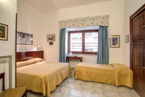 Postel nebo postele na pokoji v ubytování Hotel Primavera