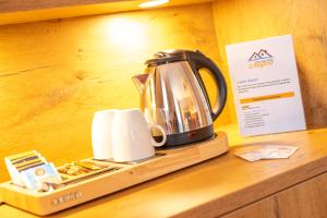 a tea kettle sitting on top of a counter at Boutique Hotel Angerer in Murnau am Staffelsee
