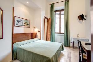 Postel nebo postele na pokoji v ubytování Hotel Primavera
